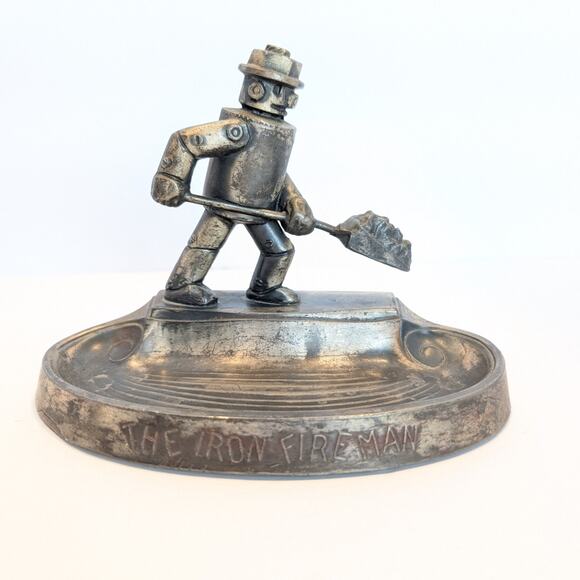 Rare Collectable The Iron Fireman Metal Art Paper Weight Vintage